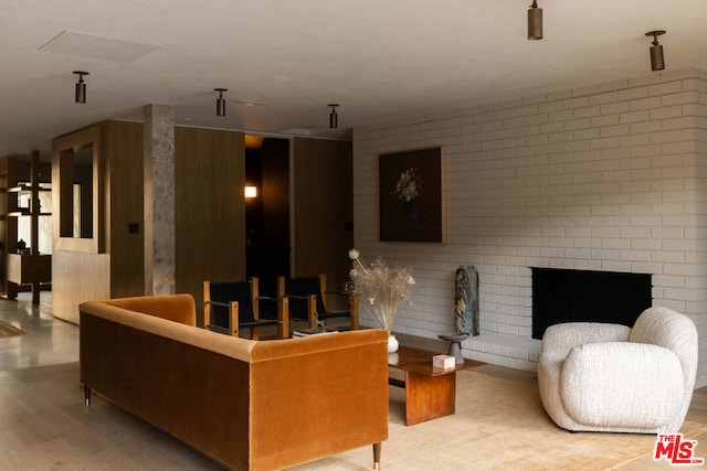 living room with a fireplace and hardwood / wood-style flooring