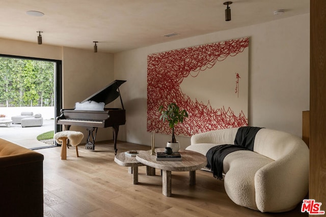 sitting room featuring light hardwood / wood-style flooring