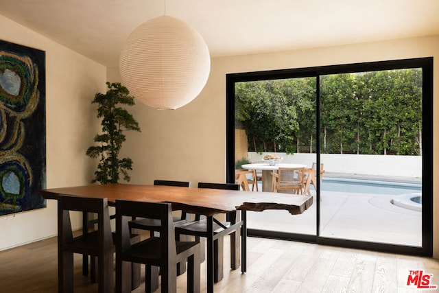 dining space featuring light hardwood / wood-style floors