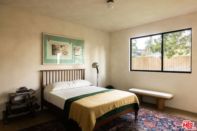 bedroom featuring hardwood / wood-style floors