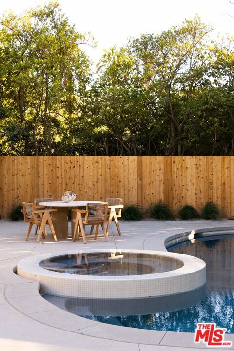 view of swimming pool with a patio