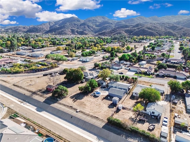 birds eye view of property featuring a mountain view