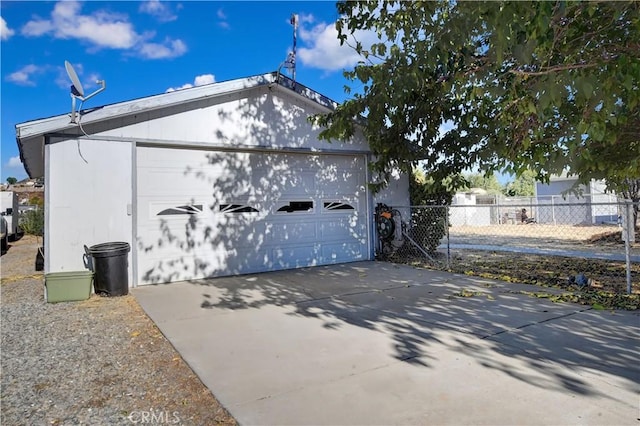 view of side of property with a garage and an outdoor structure