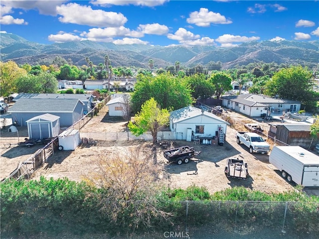 birds eye view of property featuring a mountain view