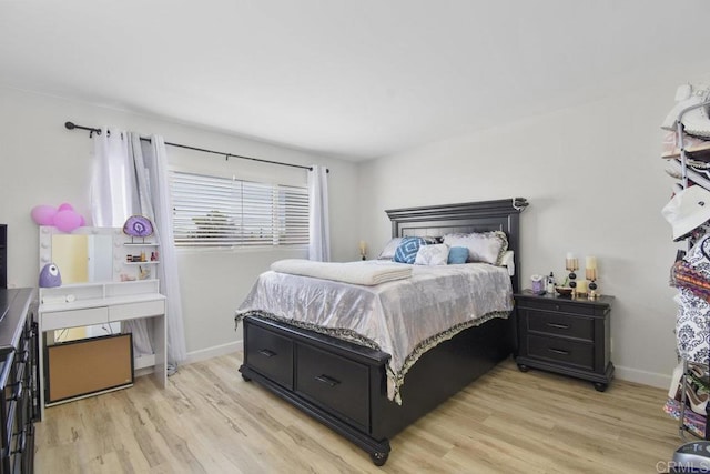 bedroom with light wood-type flooring