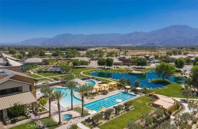 bird's eye view with a water and mountain view