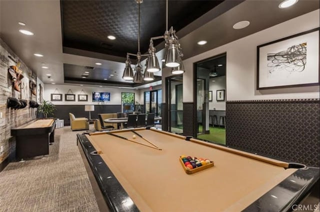 game room with pool table, carpet floors, and a tray ceiling