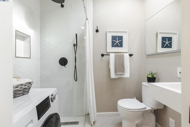 bathroom featuring tiled shower and toilet