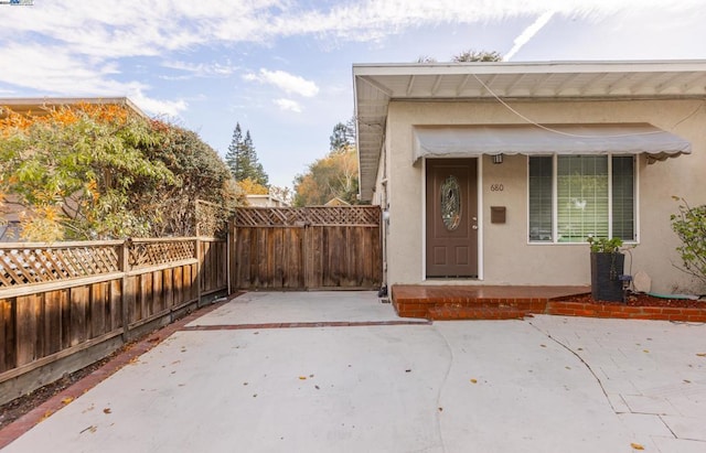 entrance to property with a patio area