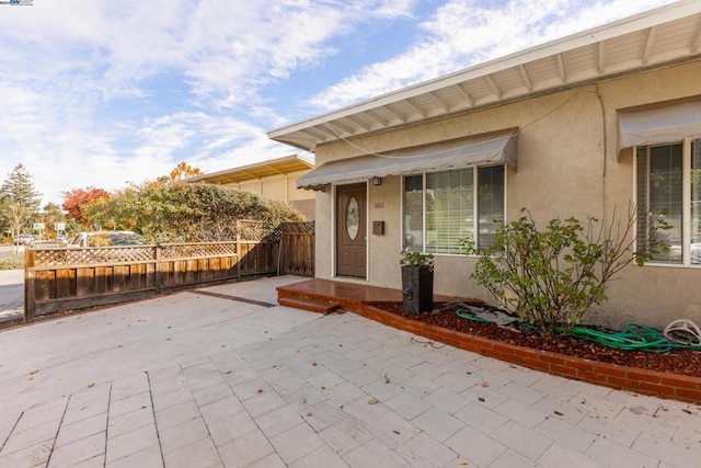 doorway to property featuring a patio