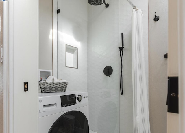 clothes washing area featuring washer / clothes dryer