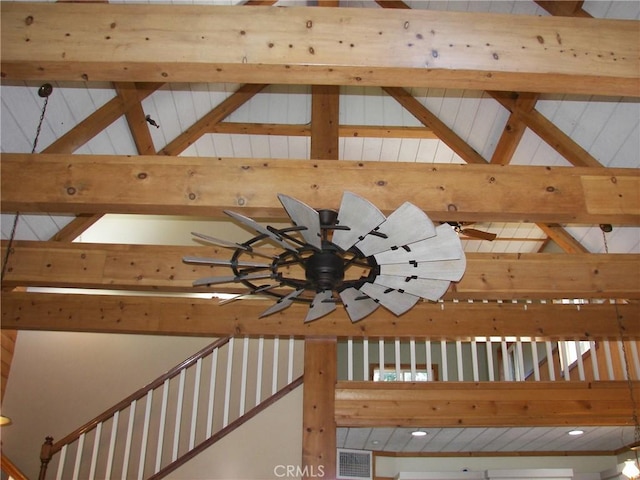 room details featuring ceiling fan and beamed ceiling