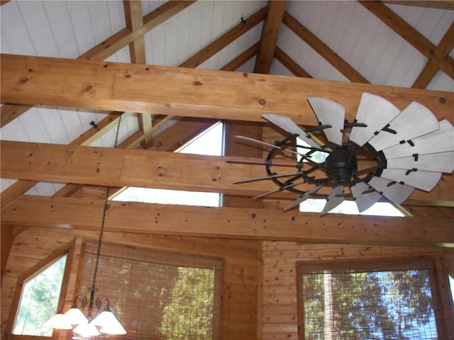 details featuring a notable chandelier and beam ceiling