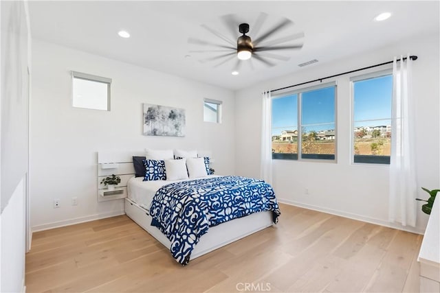 bedroom featuring hardwood / wood-style floors and ceiling fan