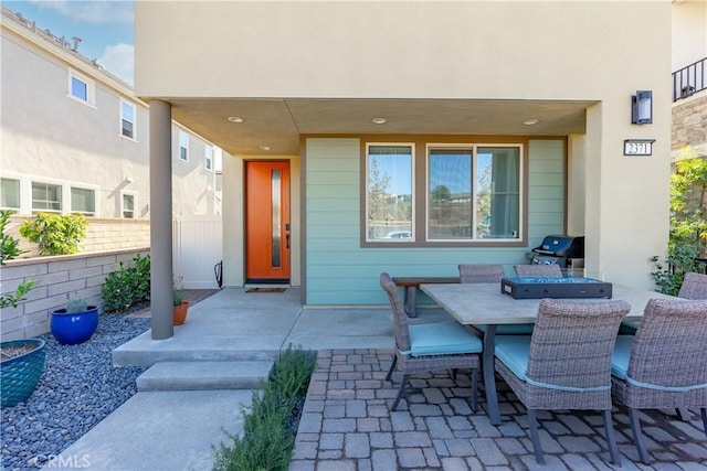 view of patio featuring a grill