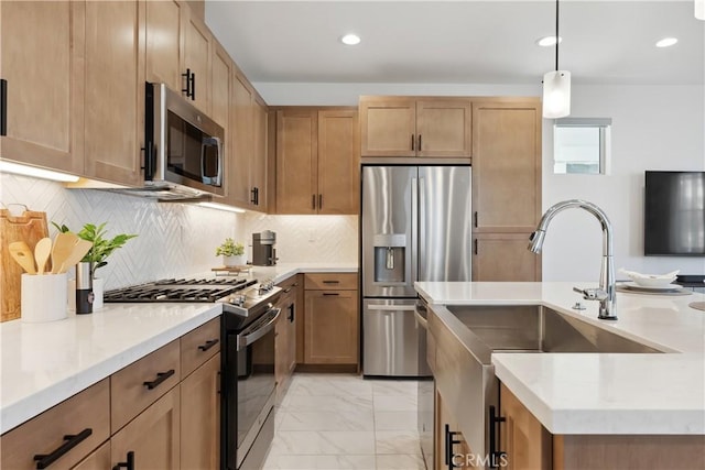 kitchen featuring sink, hanging light fixtures, tasteful backsplash, light stone counters, and stainless steel appliances