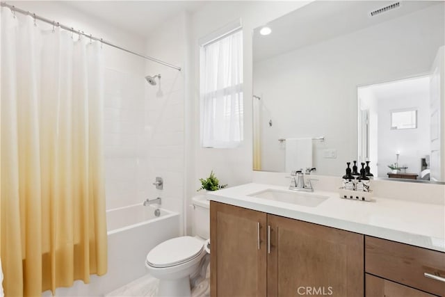 full bathroom featuring shower / bath combination with curtain, toilet, and vanity