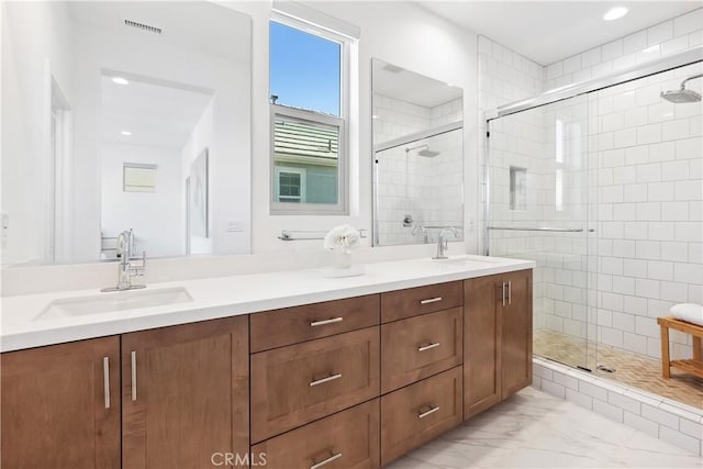 bathroom with vanity and walk in shower