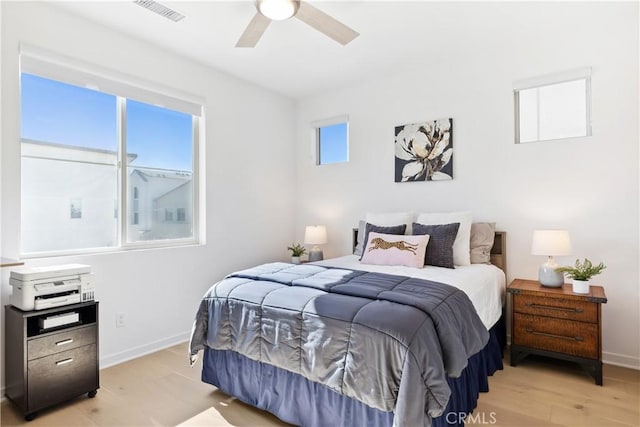 bedroom featuring light hardwood / wood-style flooring and ceiling fan