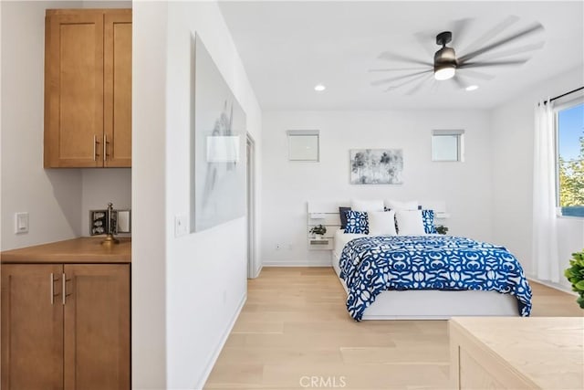 bedroom featuring ceiling fan and light wood-type flooring