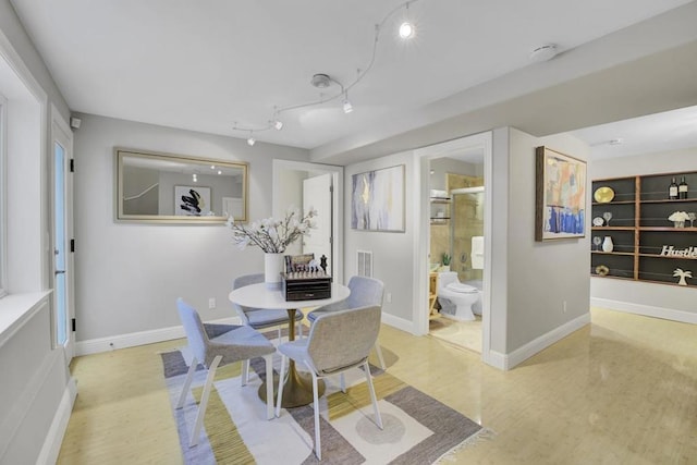 dining space with light hardwood / wood-style flooring