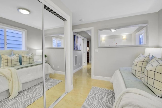 bathroom with hardwood / wood-style flooring