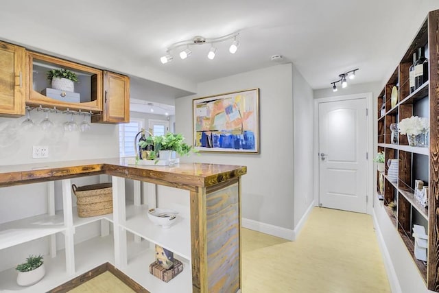 kitchen featuring tasteful backsplash and light hardwood / wood-style flooring