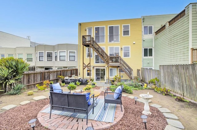 back of house with a patio area and outdoor lounge area