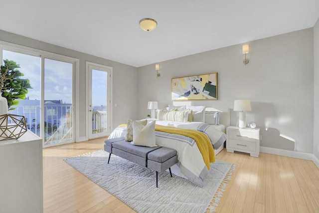 bedroom featuring light hardwood / wood-style floors and access to outside