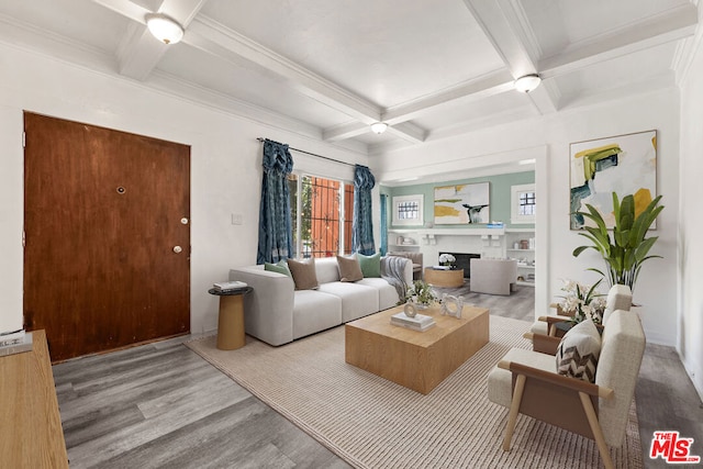 living room with beamed ceiling, light hardwood / wood-style floors, coffered ceiling, and ornamental molding