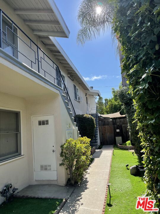 view of property exterior with a yard