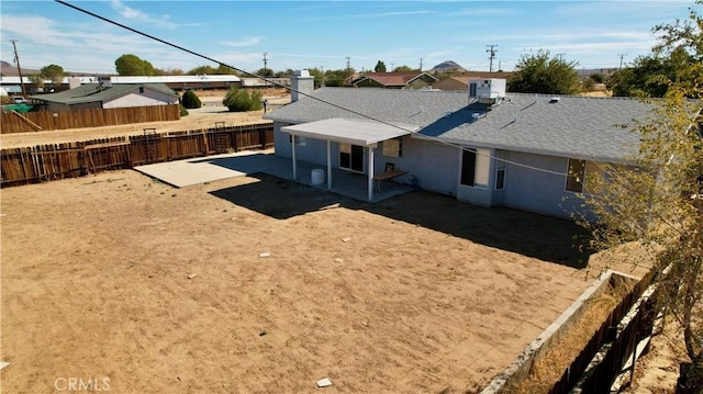 back of property featuring a patio area and central AC