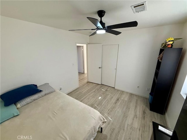 unfurnished bedroom featuring ceiling fan and light hardwood / wood-style floors