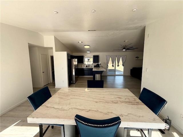 dining room featuring hardwood / wood-style flooring and ceiling fan