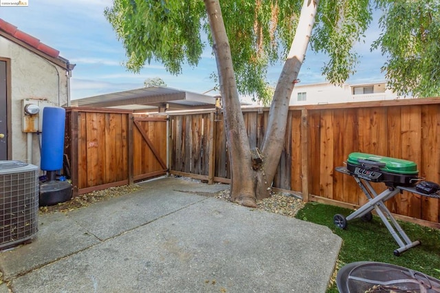 view of patio / terrace with a grill and cooling unit