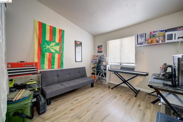 interior space with vaulted ceiling and light wood-type flooring