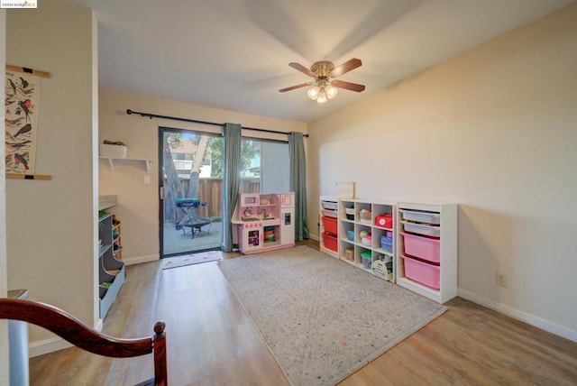 game room with ceiling fan and hardwood / wood-style flooring