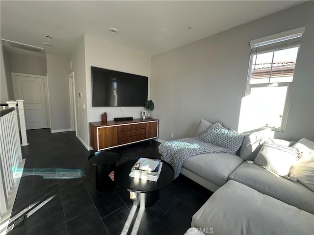 living room featuring dark tile patterned floors