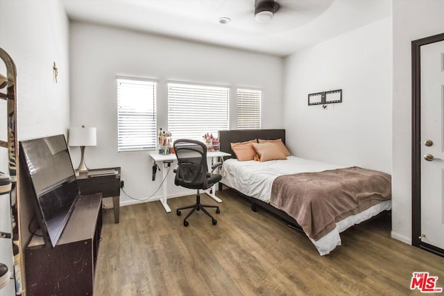 bedroom with hardwood / wood-style flooring and ceiling fan