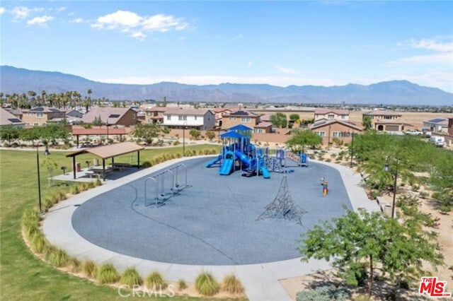 birds eye view of property featuring a mountain view