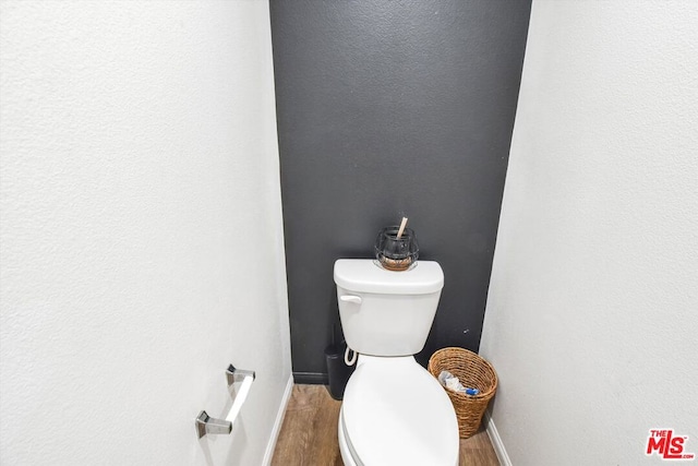 bathroom featuring toilet and hardwood / wood-style flooring