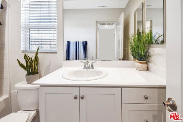 bathroom with vanity and toilet