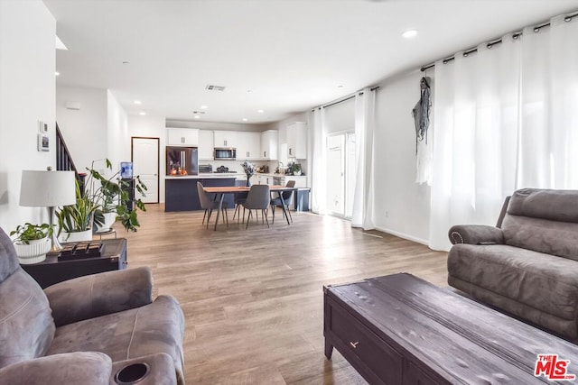 living room featuring light hardwood / wood-style flooring