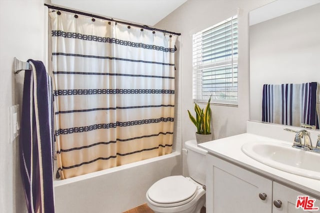 full bathroom with shower / bath combo with shower curtain, vanity, and toilet