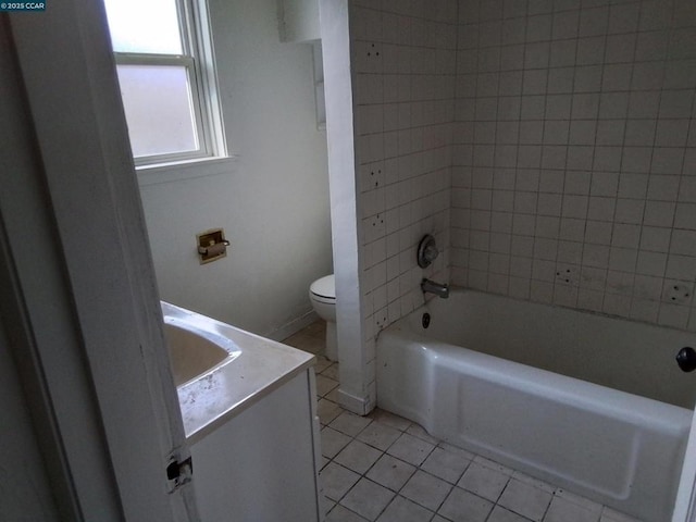 bathroom with tile patterned floors, vanity, and toilet