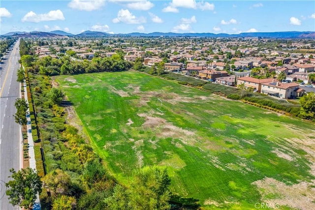 birds eye view of property with a residential view and a mountain view