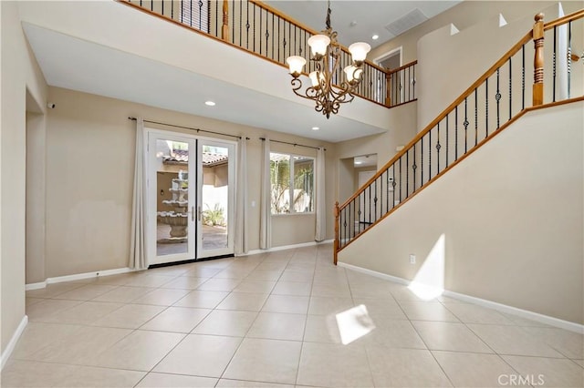 entrance foyer with stairs and baseboards