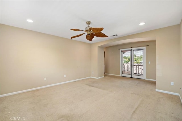 spare room with recessed lighting, visible vents, a ceiling fan, light carpet, and baseboards