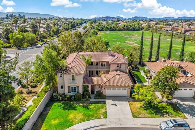 birds eye view of property featuring a mountain view and a residential view