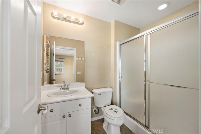 bathroom featuring visible vents, toilet, tile patterned floors, vanity, and a shower stall